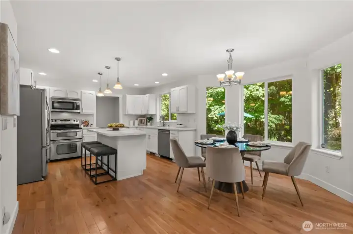 The kitchen has an eat in dining space and new quartz counters and all stainless steel appliances.