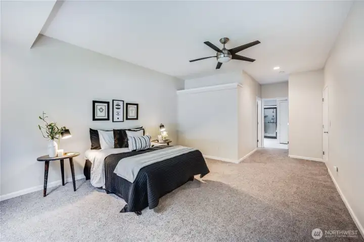 With a walk-in closet and private full bath at one end, the primary suite offers ample room and an ideal layout.