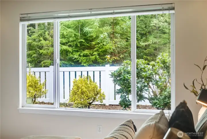 Peaceful views of nature outside are enjoyed every season through the primary suite window.