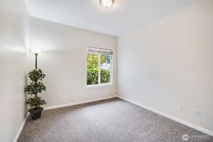 This second bedroom in the home can be used as a guest room or hobby room. It also features fresh paint and new carpet.