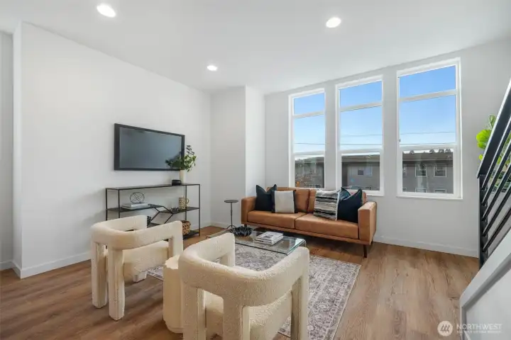 Great Room floor plan (second level). Abundance of windows throughout floods the home in natural light.  Photos are of model home of similar floorplan. Color scheme and layout will vary.