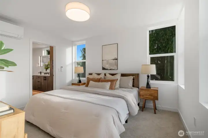 Third level is the Primary Suite (staged with a King Size bed!), includes en-suite Bathroom & walk-in closet.    Photos are of model home of similar floorplan. Color scheme and layout will vary.