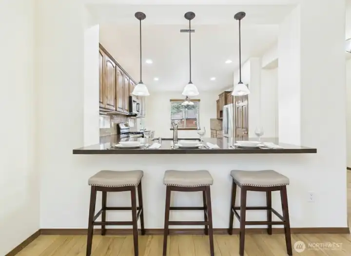 Breakfast bar opens to the kitchen.  Perfect for casual gatherings.