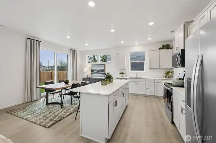 Big slider to the spacious backyard provides lots of light into your home.  Pictures are for representational purposes only, colors and features may vary.