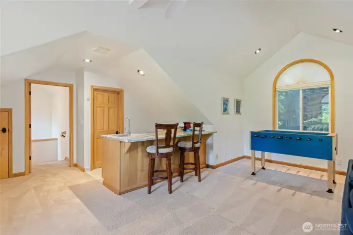 Bonus Room over main house garage.    Includes Bar area and 1/2 Bath