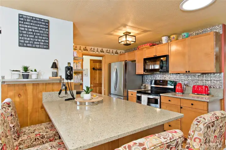 Light and bright kitchen with granite counters SS appliances