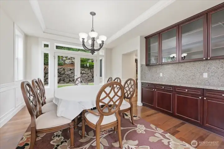 Dining room with back bar area for providing extra serving area for entertaining or large family gatherings
