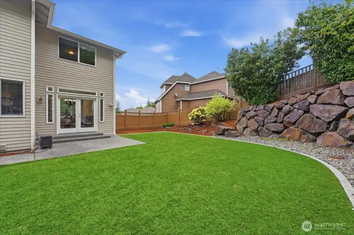 Low maintenance back yard with turf.  No mowing