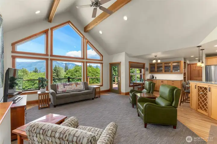 The living room with vaulted ceilings and picture windows to capture the view. The living room with vaulted ceilings and picture windows to capture the view.