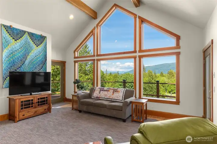 When Mt Baker is out it is framed perfectly in this wall of windows. Trim on main level is old growth fir. When Mt Baker is out it is framed perfectly in this wall of windows. Trim on main level is old growth fir.