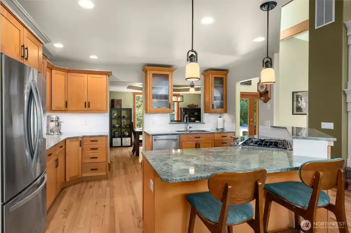 Spacious kitchen has been updated with beautiful granite counters and tile backsplash. Spacious kitchen has been updated with beautiful granite counters and tile backsplash.