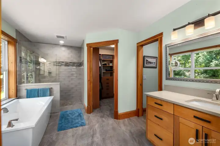 Primary bathroom has been updated with radiant tile floors, new tile shower and tub. Primary bathroom has been updated with radiant tile floors, new tile shower and tub.