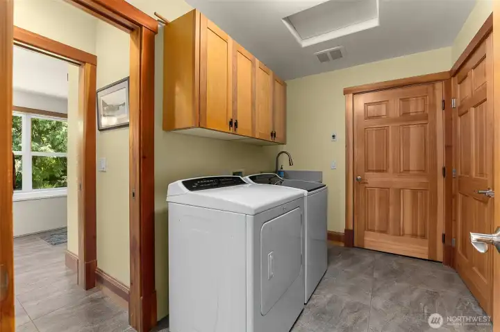 Laundry room is located conveniently located near prime bedroom, kitchen and has entry to garage. Extra storage closet. Laundry room is located conveniently located near prime bedroom, kitchen and has entry to garage. Extra storage closet.