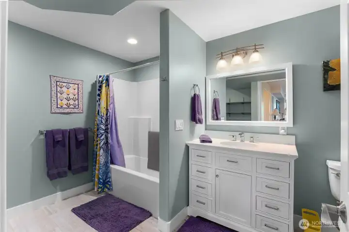 Full bathroom and laundry room on lower level Full bathroom and laundry room on lower level