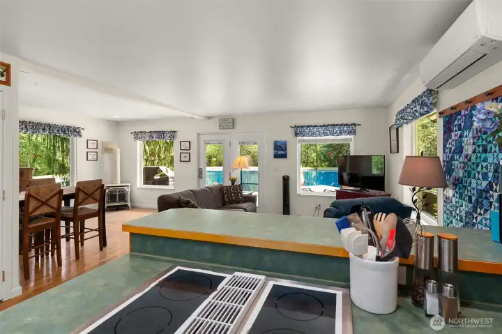 View from kitchen to living room and pond view. View from kitchen to living room and pond view.