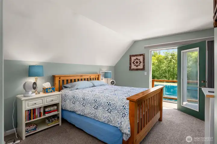 Bedroom includes walk in closet and balcony overlooking pond. Bedroom includes walk in closet and balcony overlooking pond.