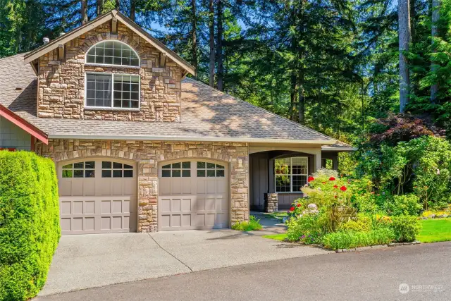 Front view of the home.Lush and green and clean.