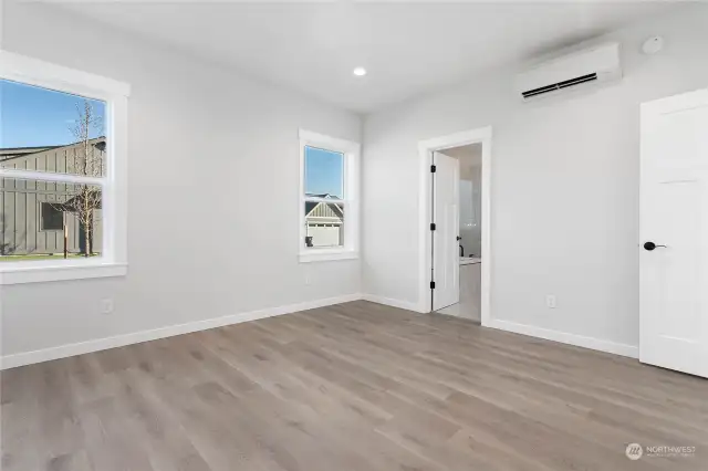 Primary Bedroom with door leading to bathroom.