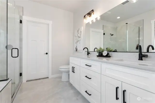 Double vanity with full length mirror.  Beautiful tile floor.