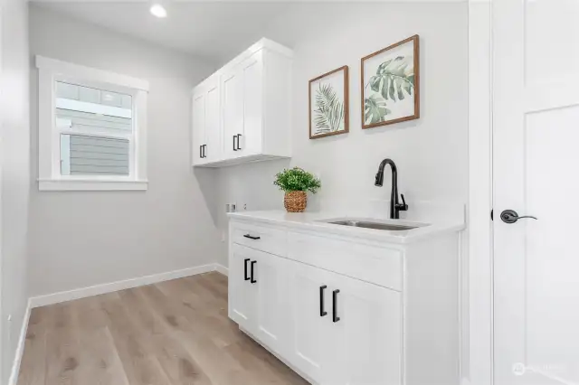 Nice utility room with extra storage.