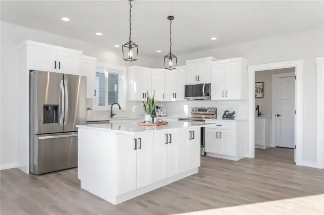 The open door leads to a nice utility room and the garage.