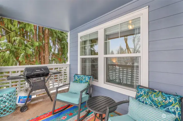 Another angle of the spacious balcony, showcasing its charming railing design and proximity to the surrounding greenery, ensuring privacy and serenity.