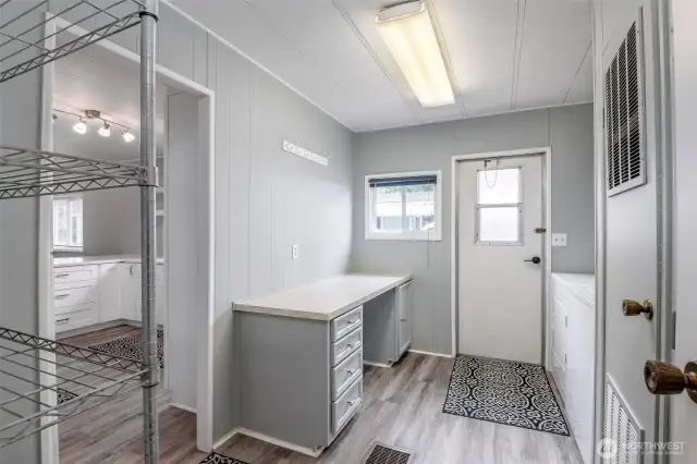 Laundry room with desk