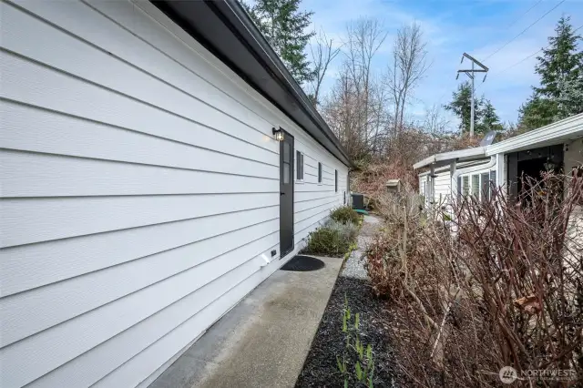 Side door enters to laundry room