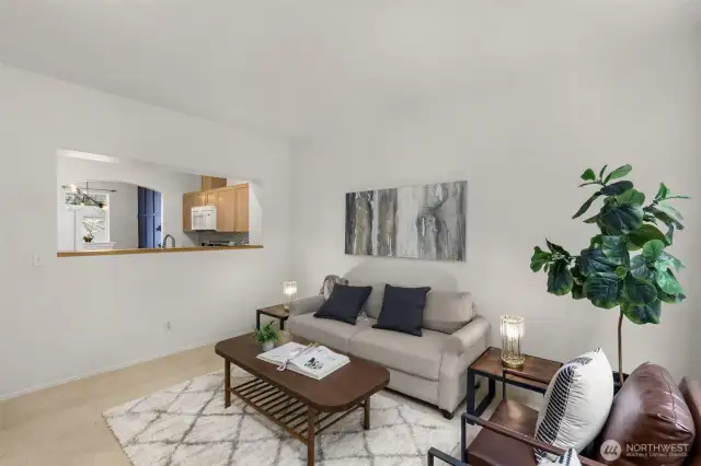 Family & living room share a gas fireplace & high ceilings