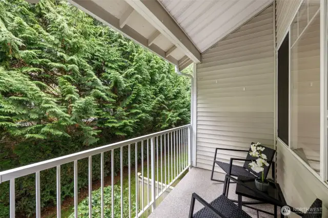 Relax on the private back deck off family room with  seclusion of the surrounding nature