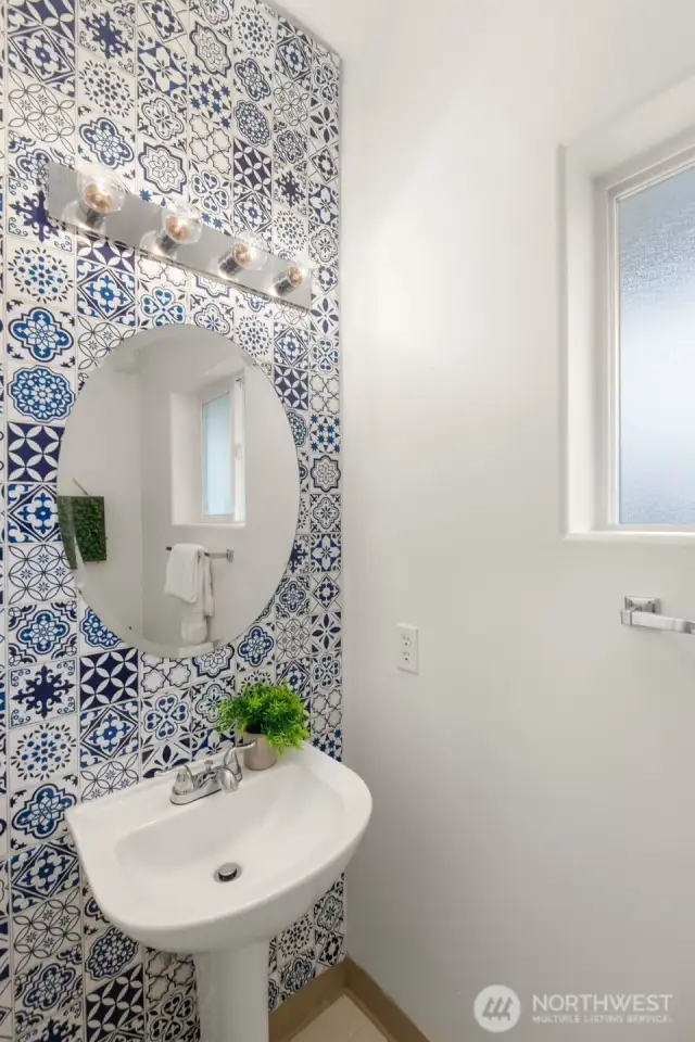 Main floor hall bath with modern wallpaper