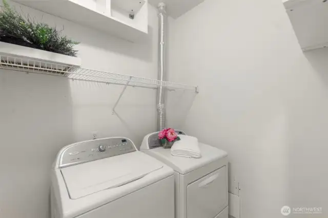 In unit Laundry with full size washer and dryer and storage shelves