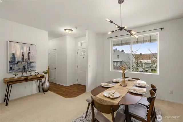 Formal dining with beautiful accent wall conveniently located next to the kitchen