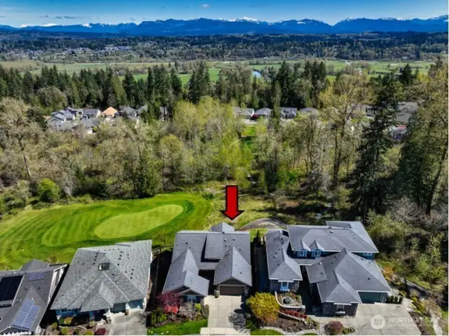 Set above the 15th green of the Redmond Ridge Golf Course is this Hemlock model home. Stunning golf course, Cascade Mountain Range and territorial views from this highly desirable floor plan.
