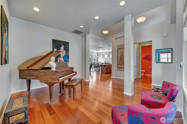The front room is marvelous for a piano, formal dining area or game table.