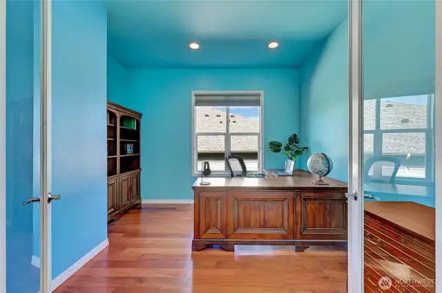 Large office with glass French doors.