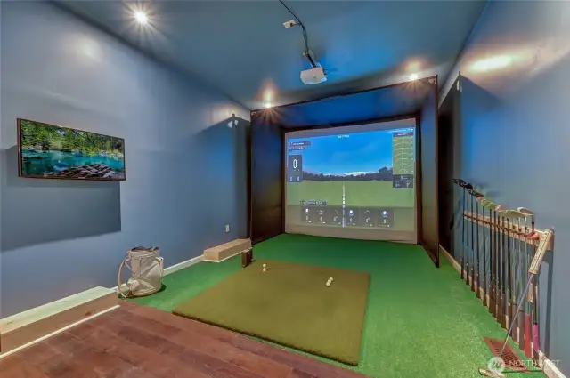 The unique downstairs room is currently used with a golf simulator so the owners can work on their swings no matter the weather.