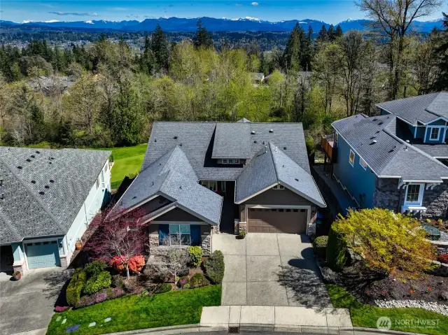 This 2 bedroom, 2.5 bathroom home with a two car garage and additional golf cart garage offers extraordinary golf course living.