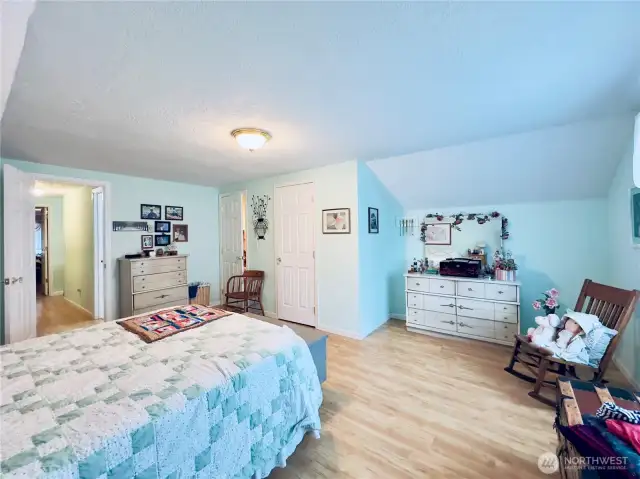 Upstairs oversize bedroom next to the bathroom with two walk-in closet areas.