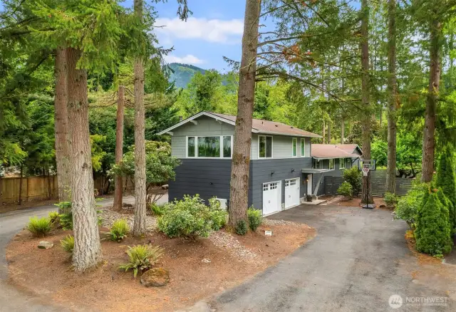 Front of the house. Entrance to the apartment is to the left of the basketball hoop. Parking and entrance is separate from the main house.