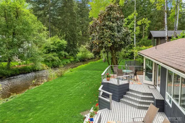 Expansive, tiered deck with hot tub and space to host a crowd in style.