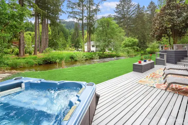 Hot tub + layered deck = the ultimate outdoor relaxation zone.