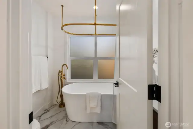 2nd Floor full bath with standalone Soaking tub/shower combo.