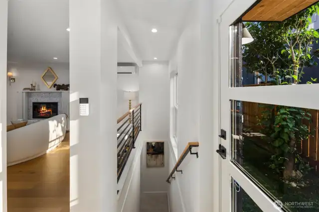 Staircase leading down to the lower area (Basement) with a 2nd living Room, 2 bedrooms, 1 full bath, & Laundry Room.