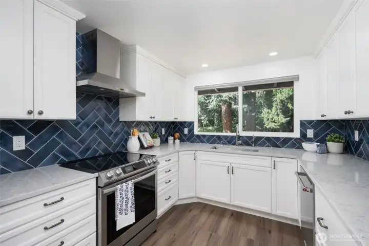 Lots of counter space and stainless steel appliances makes this kitchen a chef's delight.