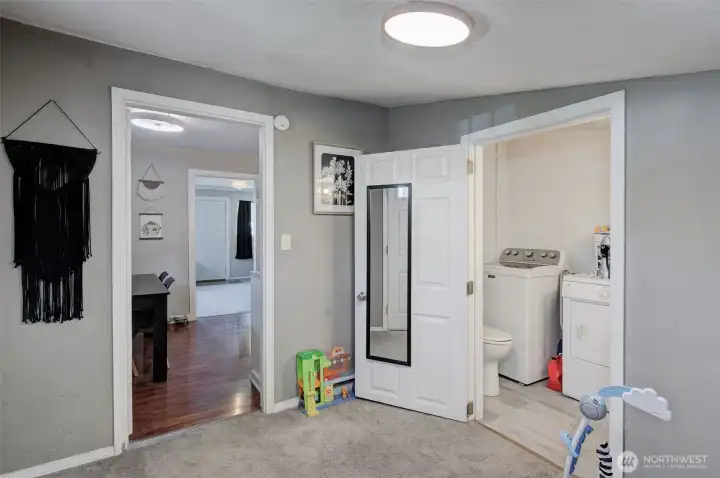 Convenient half bath serving the common living spaces.