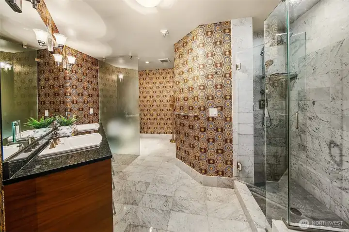spa like marble bath with over sized frameless shower and soaking tub