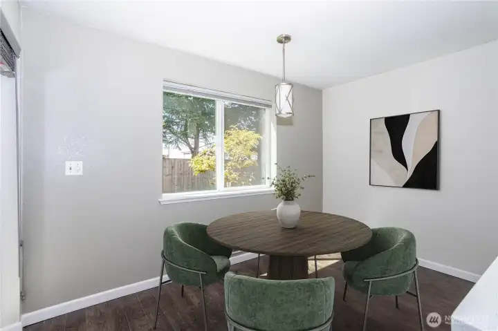 Dining area with natural light and easy access to the kitchen.