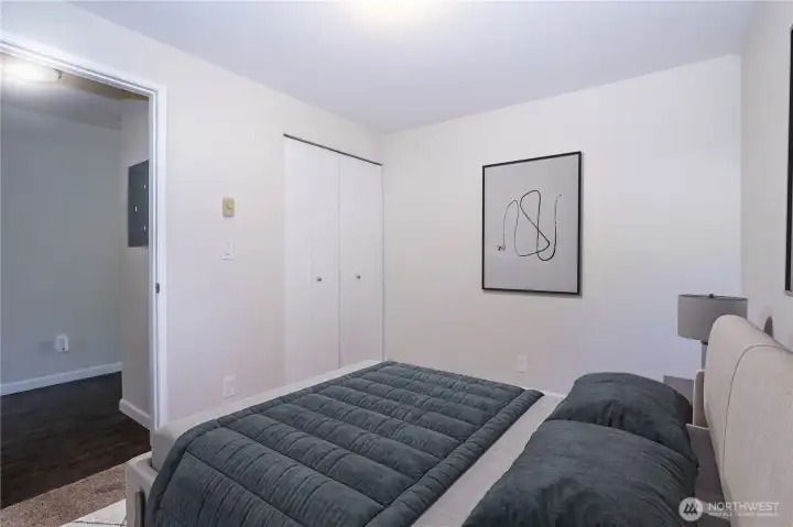 Alternate view of the Secondary bedroom showing closet access and natural light.