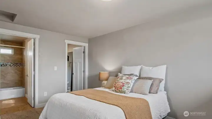 Primary showing the walk-in closet and full bathroom